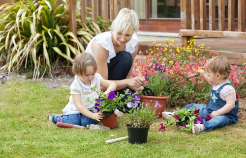 Gardener inspecting a lawn before mowing